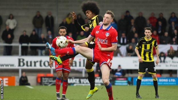 Burton's Hamza Choudhury looks to win possession in midfield