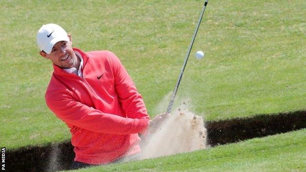 Rory McIlroy playing out of a bunker at Royal St George's