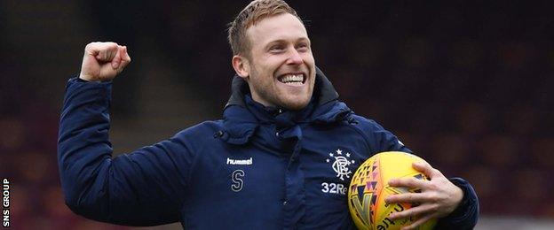 Scott Arfield celebrates with the match-ball at full-time