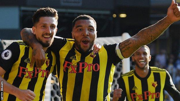 Troy Deeney celebrates with Craig Cathcart