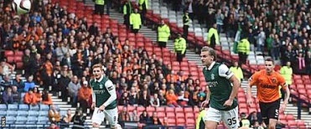 Jason Cummings watches his penalty sail over the bar