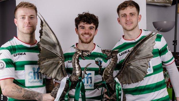 The New Saints' Ben Clark, Ash Baker and Keston Davies with the Cymru Premier trophy