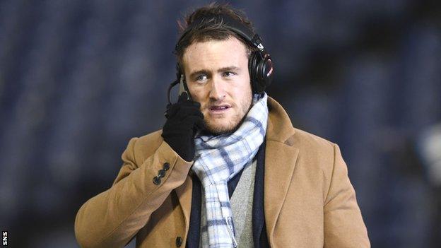 Stuart Hogg speaks into a microphone at the Edinbugh-Glasgow game at Twickenham