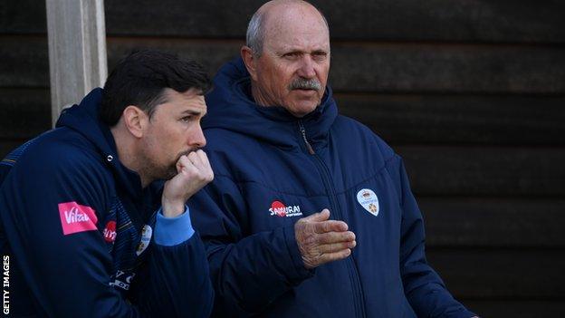 Dave Houghton (right) chats with Derbyshire captain Billy Godleman