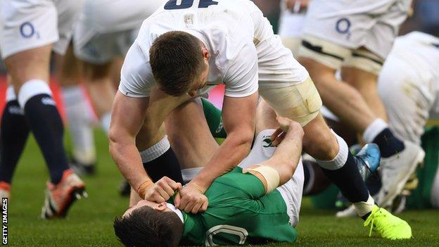 Owen Farrell pins down Ireland fly-half Johnny Sexton in England's defeat in Dublin in the 2017 Six Nations