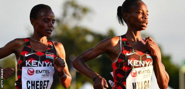 Kenya's Beatrice Chebet (left) and Caroline Nyaga (right) compete in the women's 5000m final