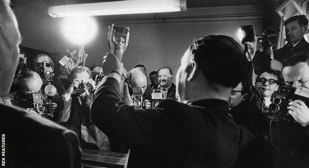 Police display the Jules Rimet trophy to the press following its discovery