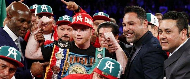 Canelo (red cap) now has 47 wins with 33 knockouts in his career