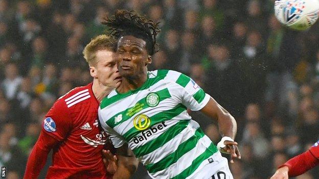 Gary Mackay-Steven contests a header with Dedryck Boyata