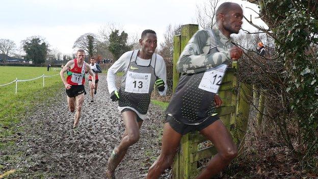 Olympic steeplechase champion Conseslus Kipruto follows Abraham Cheroben during the men's race in Antrim