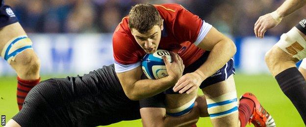 Scotland's Adam Ashe takes on the New Zealand defence