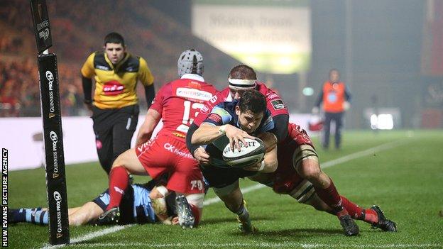 Cardiff Blues scrum-half Lloyd Williams dives over to score a try