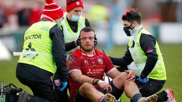 Jack Stanley is treated for a head injury