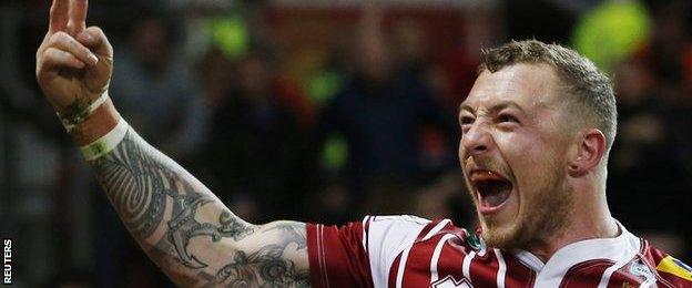 Josh Charnley celebrates his try for Wigan