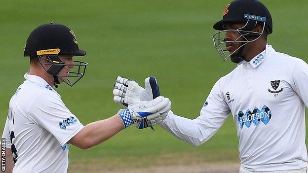 Ben Brown and Chris Jordan shake hands