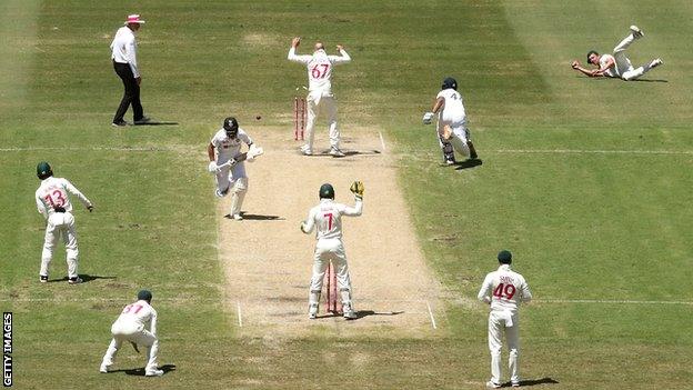 Australia bowler Josh Hazlewood (far right) runs out India batsman Hanuma Vihari on day three of the third Test