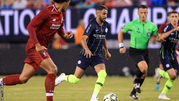 Riyad Mahrez with the ball against Liverpool