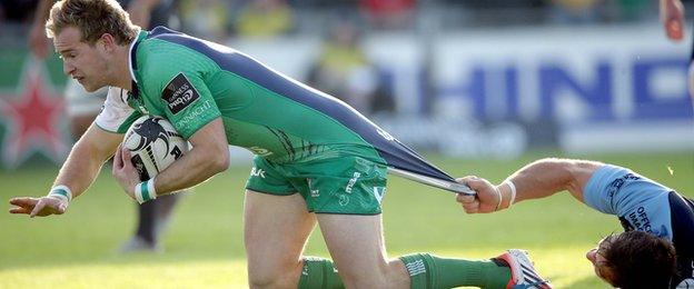 Kieran Marmion breaks away to score Connacht's opening try despite a tug from Josh Turnbull