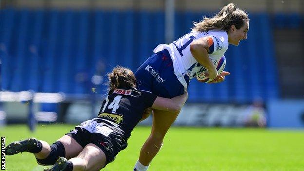 Courtney Keight is tackled with the ball playing for Bristol against Exeter