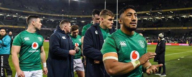 Bundee Aki leaves the field with several other Ireland players