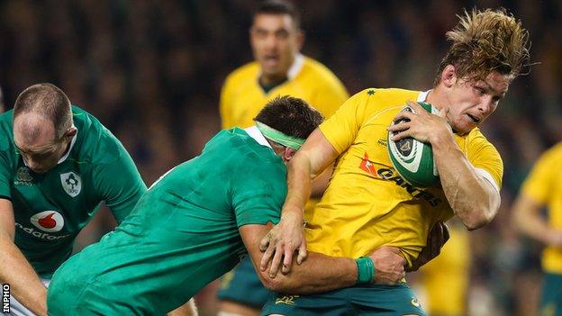 Ireland flanker CJ Stander tackles Australian back row Michael Hooper