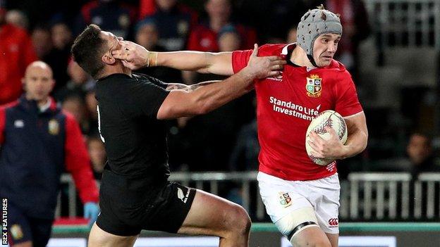 Jonathan Davies of the Lions gets away from Codie Taylor of New Zealand