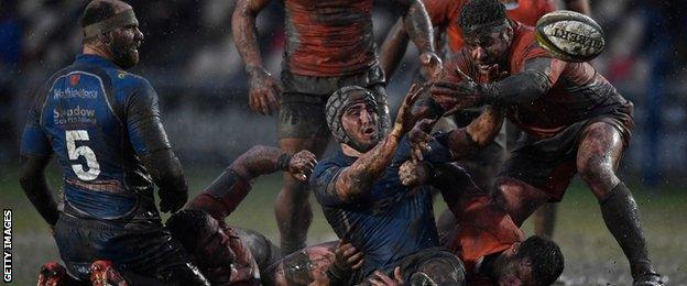 Newport Gwent Dragons take on Newcastle Falcons on a muddy Rodney Parade pitch