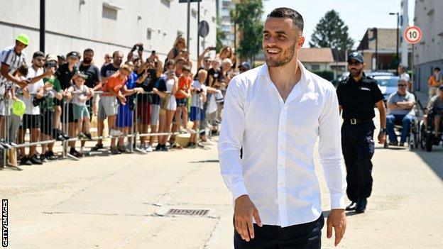 Filip Kostic arrives for his medical at Juventus