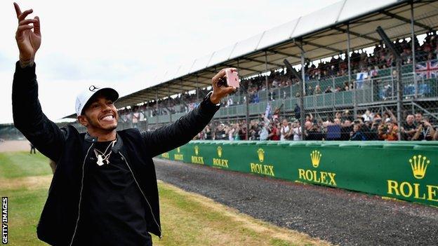 Lewis Hamilton greets fans