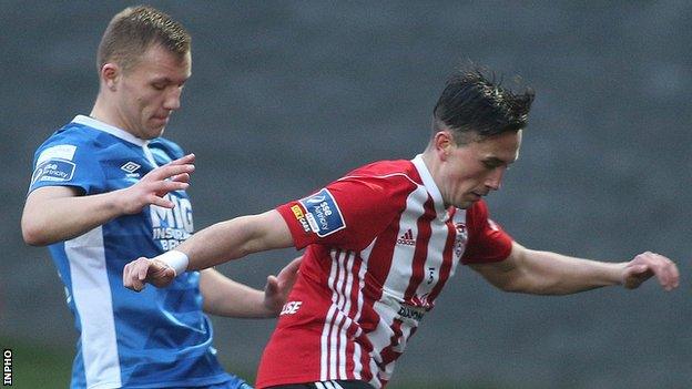 Aaron McEneff is challenged by Jamie Lennon at the Brandywell