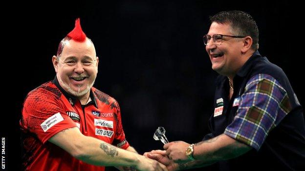 Peter Wright (left) and Gary Anderson (right) will not defend the World Cup title they won for Scotland last year