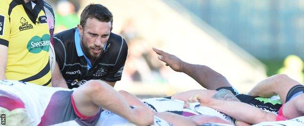 Warriors scrum-half Mike Blair casts an experienced eye over the scrum at Scotstoun