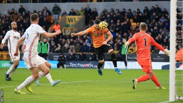 Matt Doherty scores from Raul Jimenez's cross