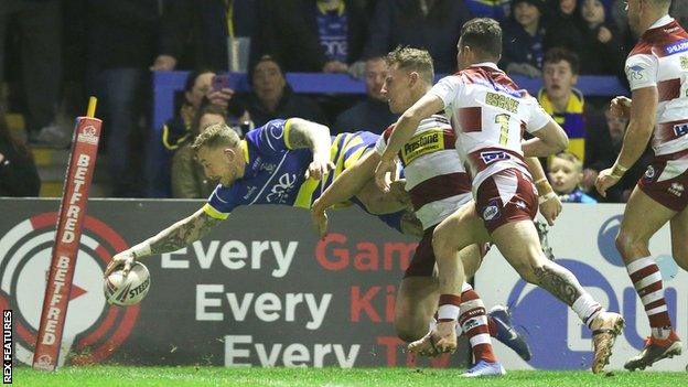 Josh Charnley scores a try for Warrington against Wigan