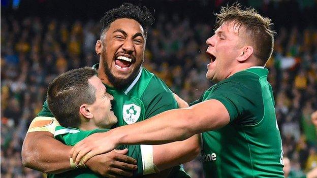 Ireland's Johnny Sexton, Bundee Aki and Jordi Murphy celebrate victory