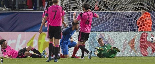 Olivier Giroud scores for France against Scotland