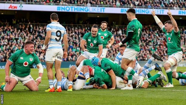 Ireland's pack celebrates their first try