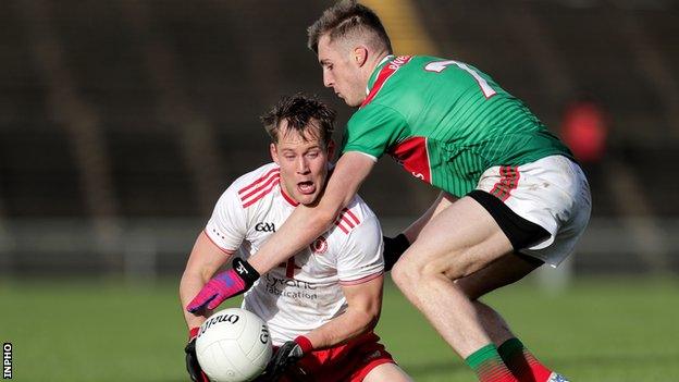 Kieran McGeary battles with Mayo's Eoghan McLaughlin in last October's League match won by Tyrone in Castlebar