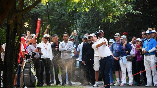 Justin Rose plays his second shot on the 18th hole during the second round of the WGC - HSBC Champions at Sheshan International Golf Club