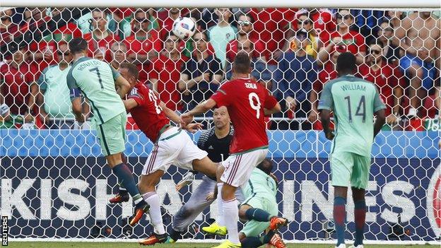 Portugal forward Cristiano Ronaldo scores a header for his country against Hungary