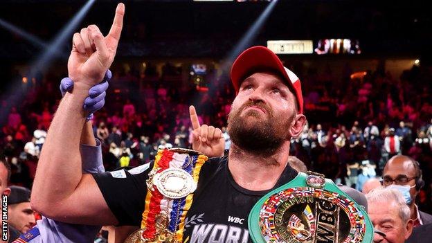 Tyson Fury poses with his Ring and WBC title