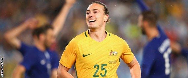 Jackson Irvine in action for Australia against Greece