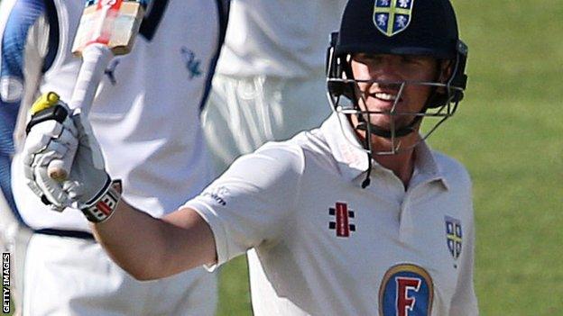 Alex Lees celebrates his 50