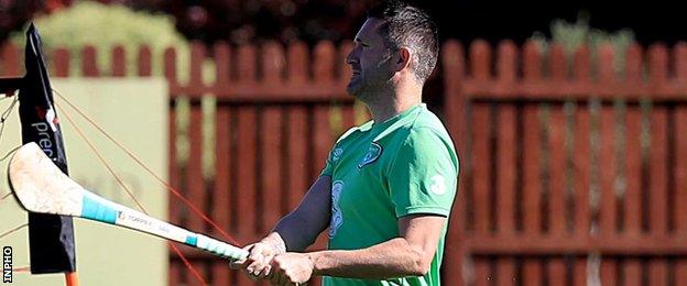 Robbie Keane swings a hurley at Republic training on Thursday morning