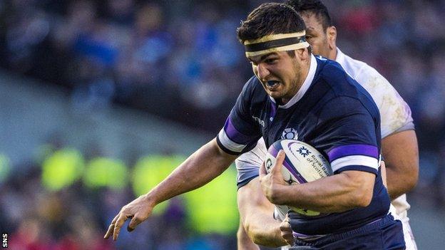 Stuart McInally runs with the ball against England