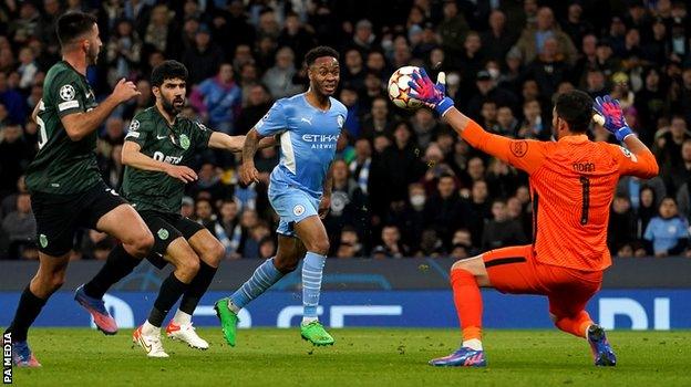 Raheem Sterling sees his shot saved by Antonio Adan