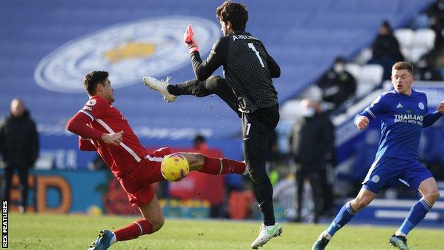 Liverpool goalkeeper Alisson (right) was involved in another defensive calamity following his mistakes against Manchester City last week