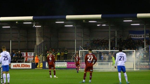 A firework went off close to Carlisle goalkeeper Michael Kelly