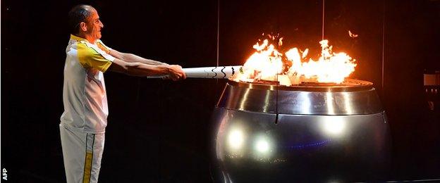 olympics torch lit by Vanderlei de Lima