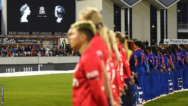 England and India players stand in silence